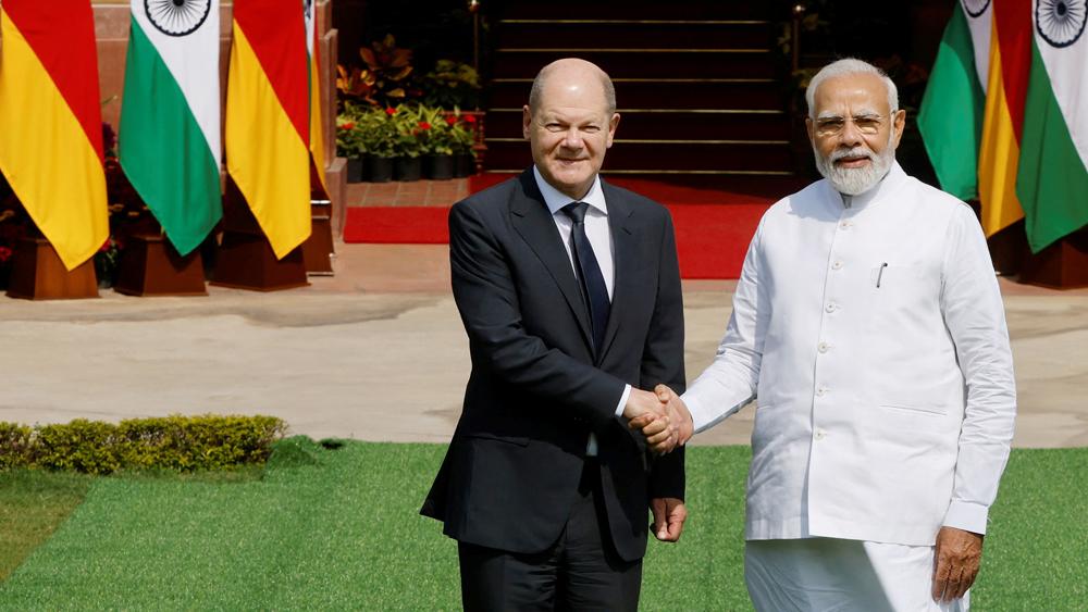 German Chancellor Olaf Scholz shakes hands with Indian Prime Minister Narendra Modi before their meeting at the Hyderabad House in New Delhi, India, February 25, 2023.