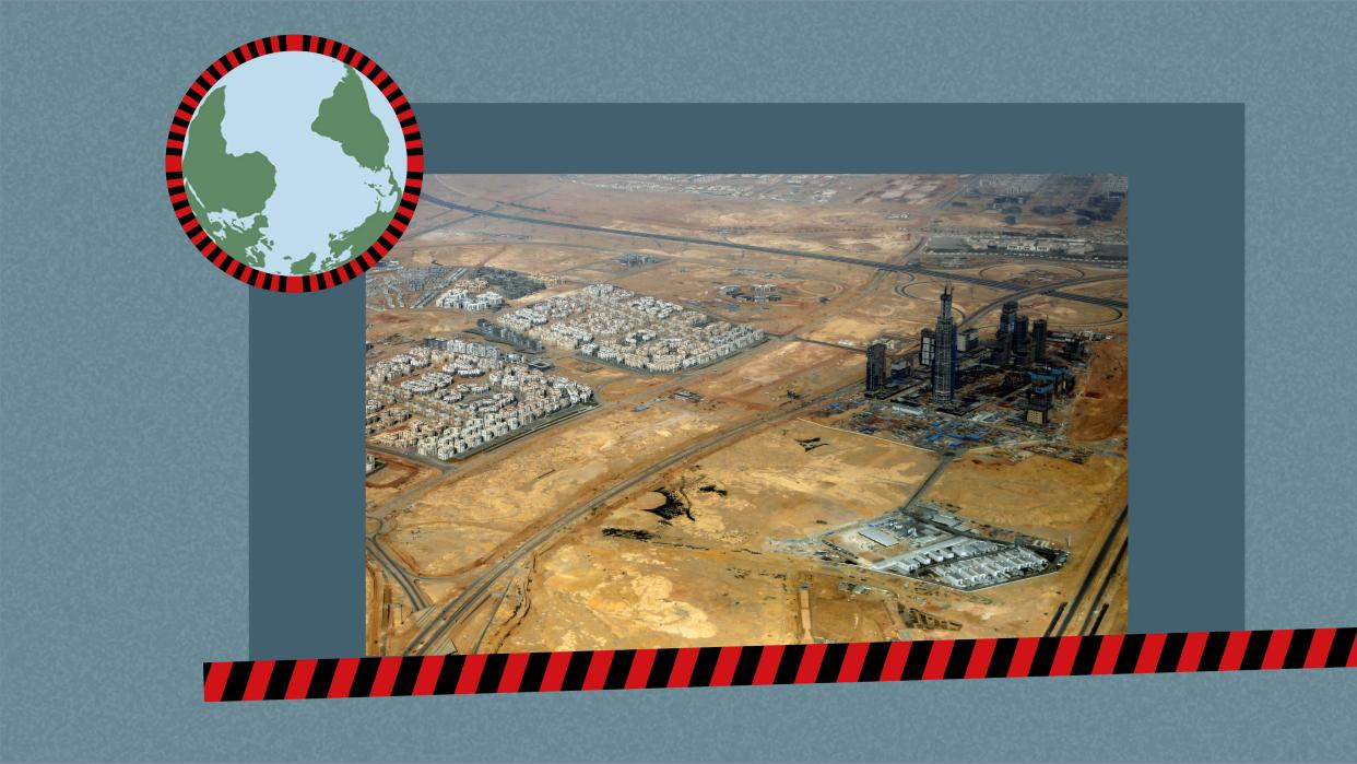 An aerial view of roads and the construction site of The Iconic Tower skyscraper, which is being built by China State Construction Engineering Corp (CSCEC) in the New Administrative Capital (NAC) east of Cairo, is pictured through the window of a plane, Egypt April 10, 2021. Picture taken April 10, 2021.