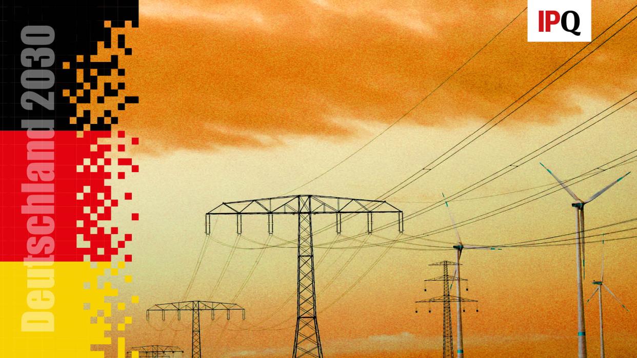 Electrical power pylons with high-voltage power lines are seen next to wind turbines near Weselitz, Germany November 18, 2022.