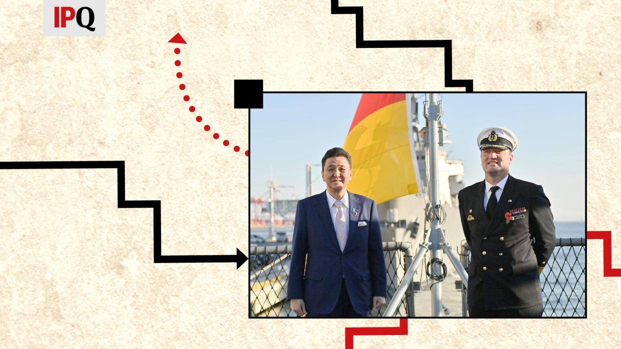 Japan’s Defense Minister Nobuo Kishi poses for a photograph with Tilo Kalski, captain of the German Navy frigate, as he visits the German navy frigate Bayern, docked at the International Cruise Terminal, in Tokyo, Japan November 5, 2021.
