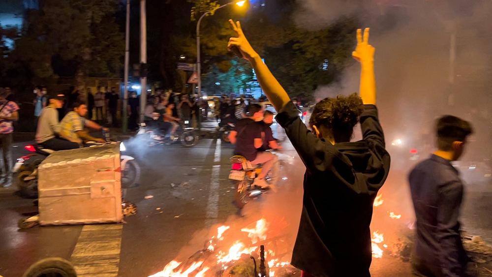 A man gestures during a protest over the death of Mahsa Amini, a woman who died after being arrested by the Islamic republic's "morality police", in Tehran, Iran September 19, 2022.