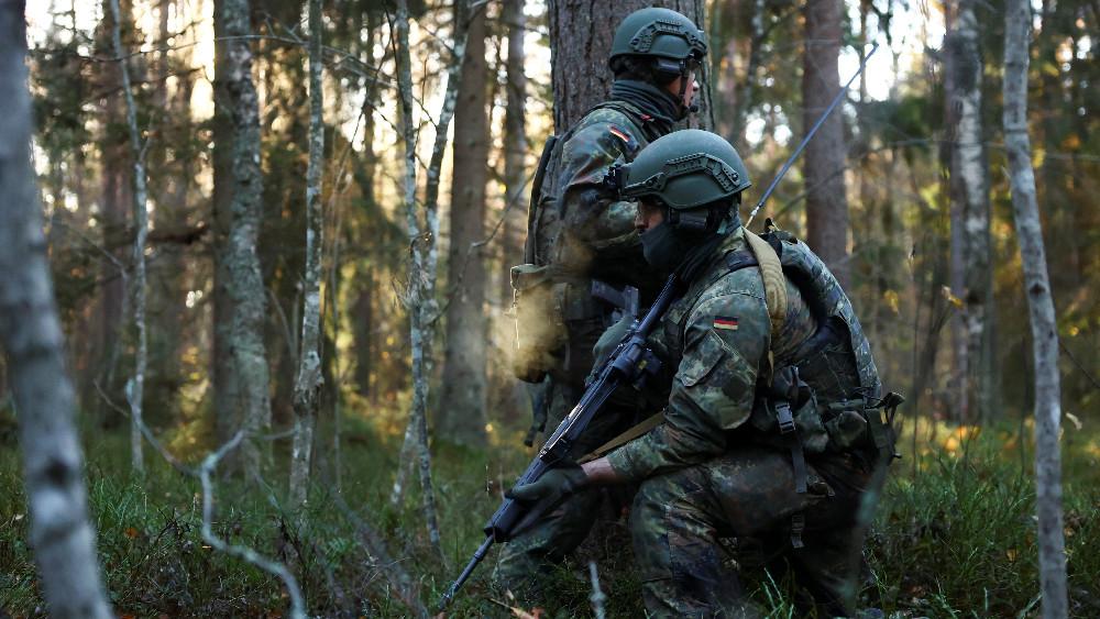 German soldiers of the Air Force Regiment take part in an exercise in the woods during the Baltic Tiger 2022 binational military exercise, which is a contribution at NATO's eastern flank, near Amari, Estonia, October 24, 2022.