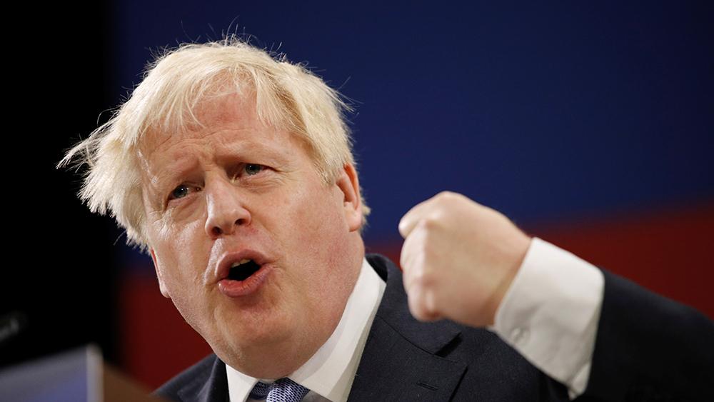 Britain's Prime Minister Boris Johnson gestures as he delivers a speech during the annual Conservative Party Conference, in Manchester, Britain, October 6, 2021.