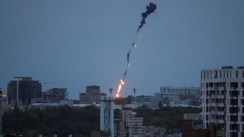 An explosion of a drone is seen in the sky over the city during a Russian drone strike, amid Russia's attack on Ukraine, in Kyiv, Ukraine May 4, 2023.