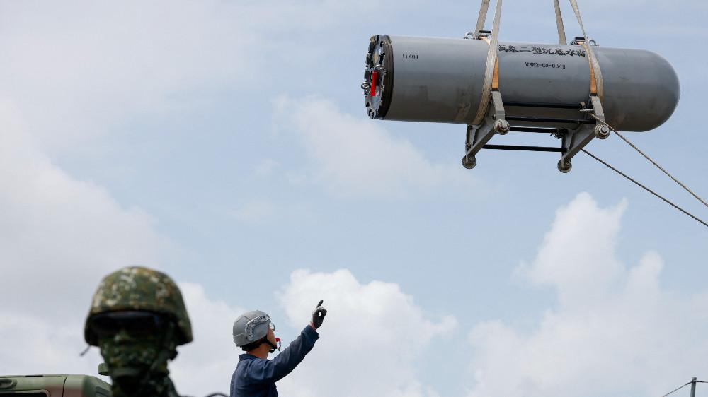Soldiers load sea mines at a military base during the annual Han Kuang military exercise in Kaohsiung, Taiwan July 14, 2025.