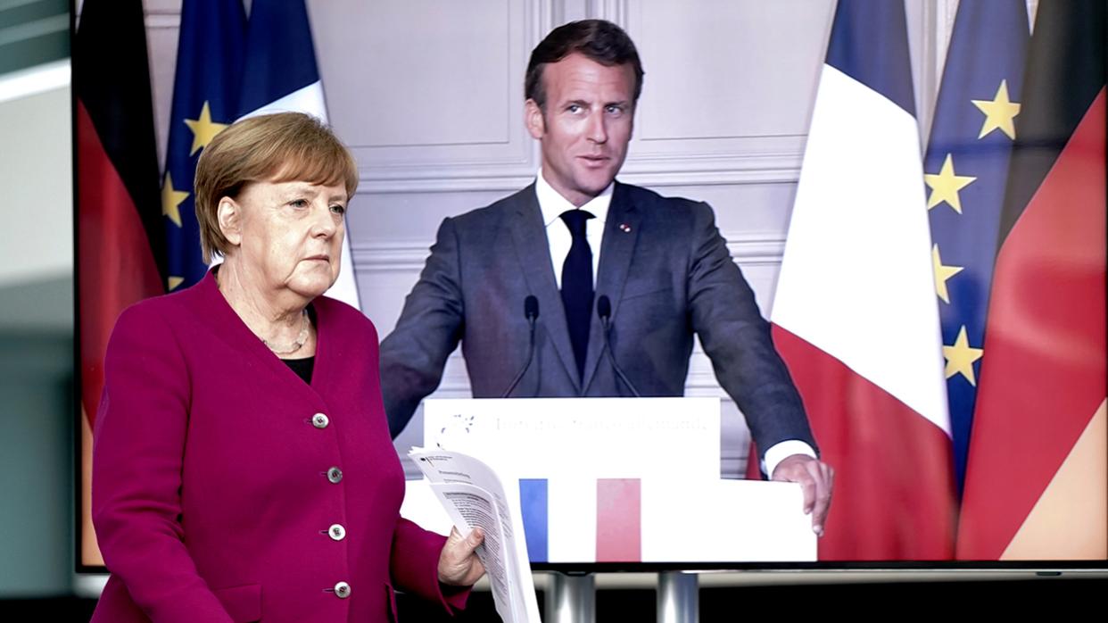 Angela Merkel and Emmanuel Macron before the start of a video press conference