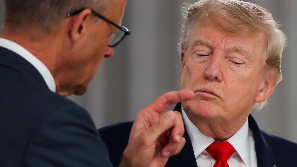 US President Donald Trump listens to Germany's Chancellor Friedrich Merz at a working lunch with leaders of G7 and the Middle East during the G7 summit, in Evian-les-Bains, France, June 16, 2026.