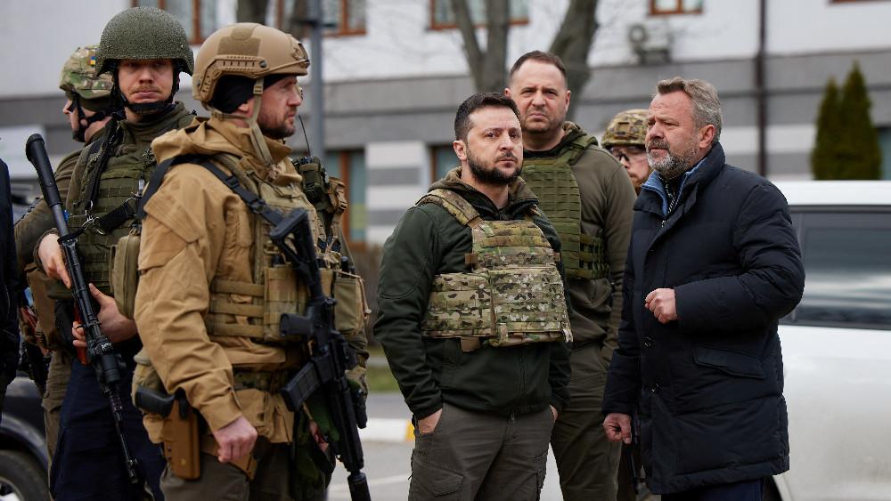 DOCUMENT DATE:  04 April, 2022  Ukraine's President Volodymyr Zelenskiy speaks to a local mayor Anatolii Fedoruk, as Russia's attack on Ukraine continues, in the town of Bucha, outside of Kyiv, Ukraine April 4, 2022.