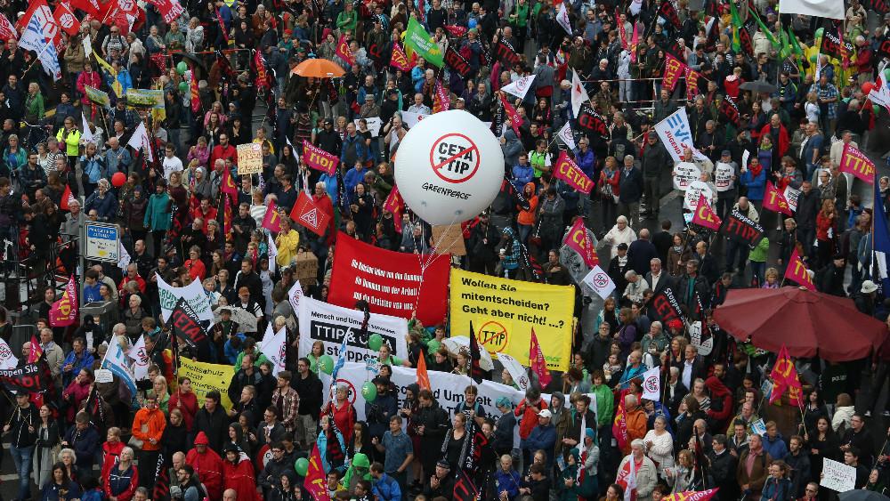 Consumer rights activists take part in a march to protest against the Transatlantic Trade and Investment Partnership (TTIP) and Comprehensive Economic and Trade Agreement (CETA) in Berlin, Germany, September 17, 2016.