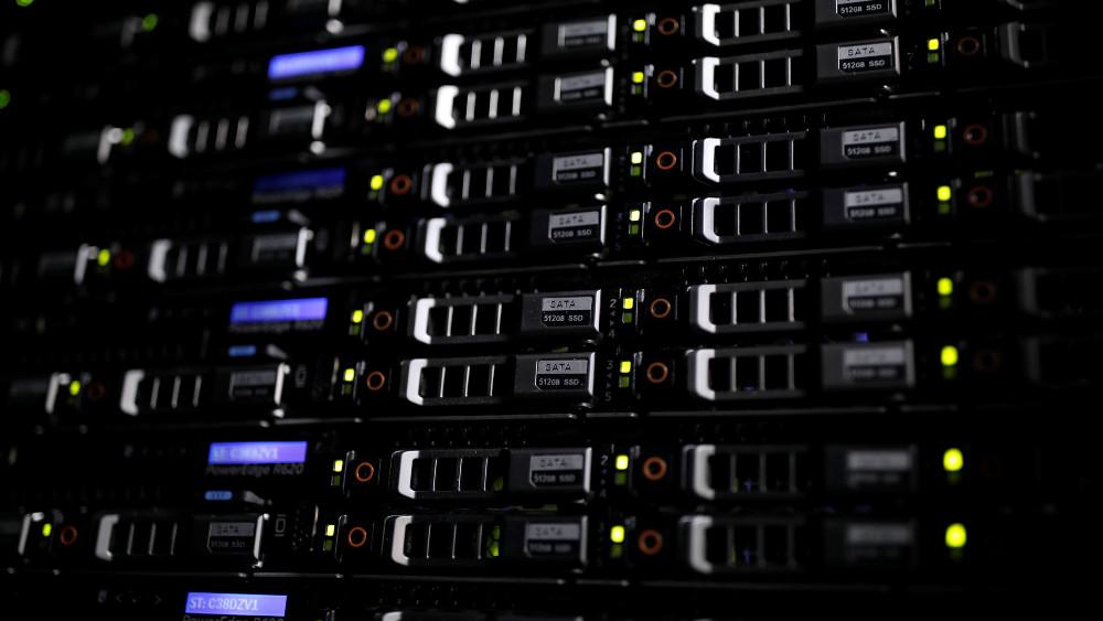 Lights illuminate rack servers inside the data center of Equinix in Pantin, outside Paris, France, December 7, 2016.