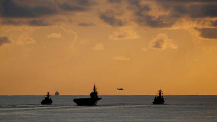 British frigate HMS Argyll, Japanese helicopter carrier Kaga and Japanese destroyer Inazuma are silhouetted against the sky during a joint naval drill in the Indian Ocean, September 26, 2018. Picture taken September 26, 2018.