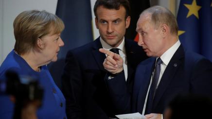 Angela Merkel, Emmanuel Macron, and Vladimir Putin