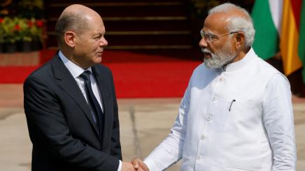 German Chancellor Olaf Scholz shakes hands with Indian Prime Minister Narendra Modi before their meeting at the Hyderabad House in New Delhi, India, February 25, 2023.
