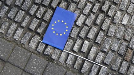 European Union flag lies on the ground during the Pro-Europe "Pulse of Europe" movement protest at Gendarmenmarkt square in Berlin, Germany, April 2, 2017.