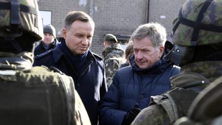 President of Poland Andrzej Duda and President of Finland Sauli Niinisto (R) meet with Finnish conscripts during their visit to the Santahamina Military Base in Helsinki, Finland October 25, 2017.