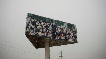 A poster showing Chinese President Xi Jinping stands in an industrial park outside the Kashgar prison in Kashgar, Xinjiang Uyghur Autonomous Region, China, May 3, 2021. Picture taken May 3, 2021.